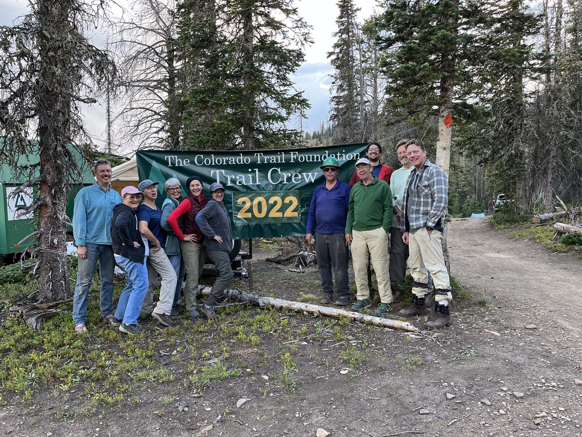 ctf 2022 trail crew pose with sign