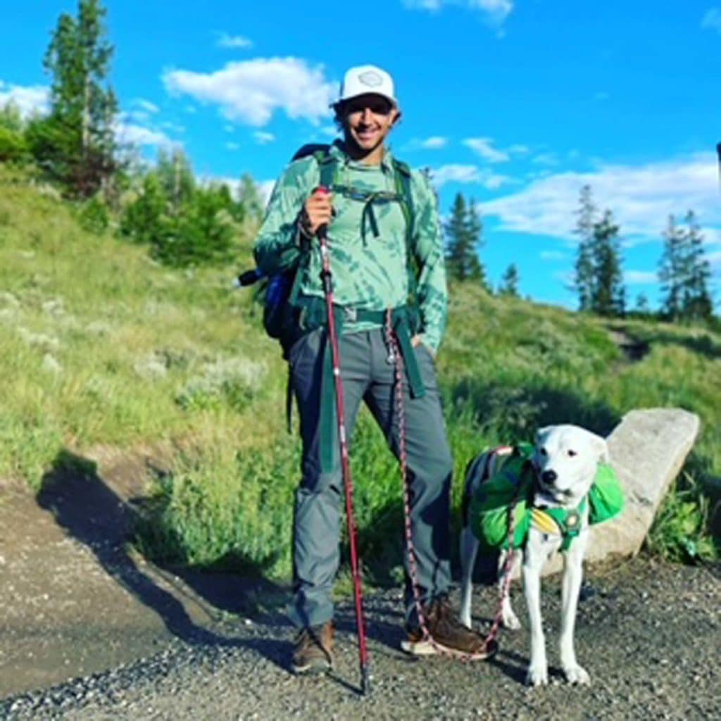 dog hiker with dog wearing pack