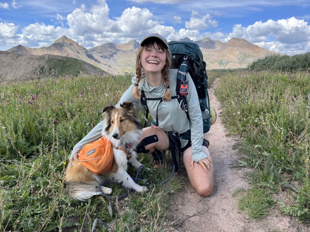 girl with dog hiker with collie on the colorado trail