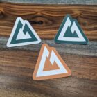 3 colors of stickers lying on a table